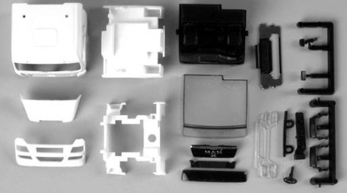 MAN TGX XLX driver's cabin without side skirting, with roof spoiler (incl. rear-view mirror)Content: 2 pcs. Herpa scale 1/87 